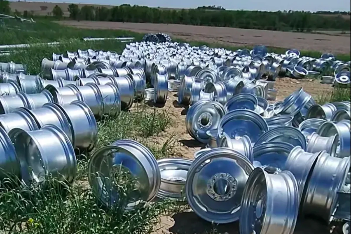 Galvanized center pivot wheel rims and hubs in the stock yard