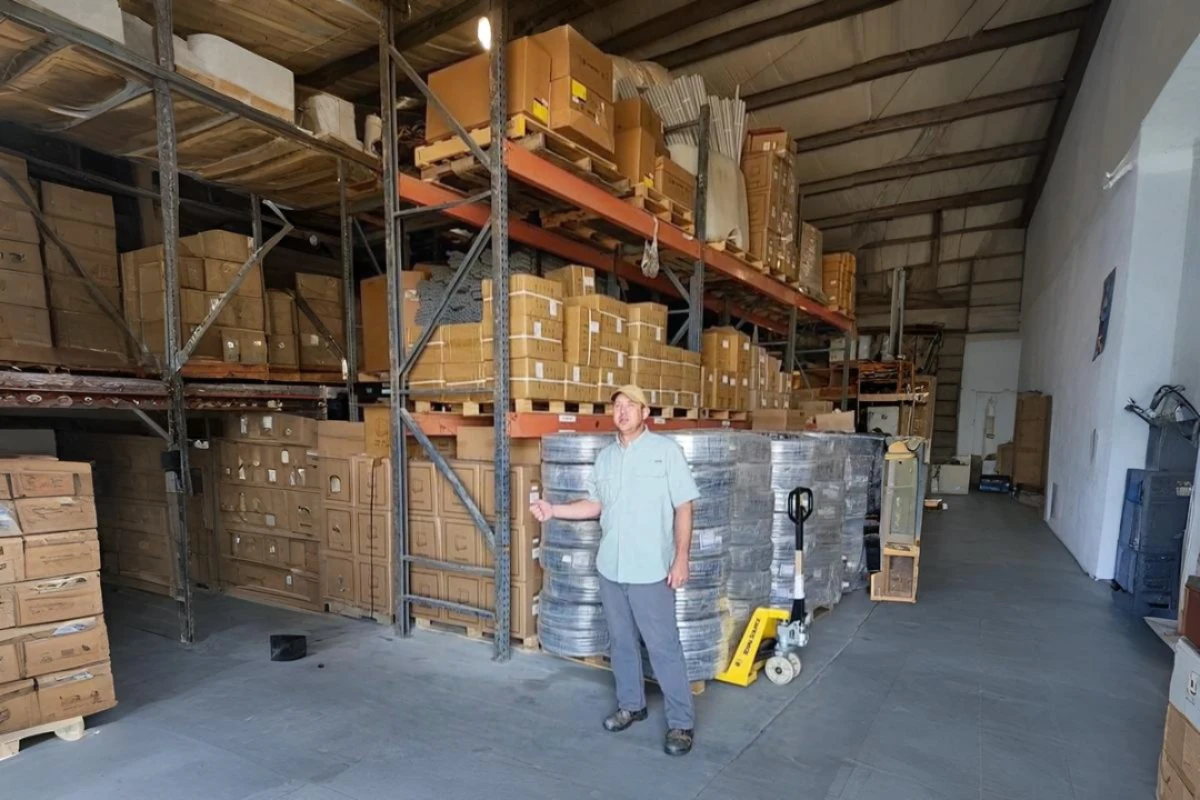 Warehouse interior with shelves of boxed center pivot inventory
